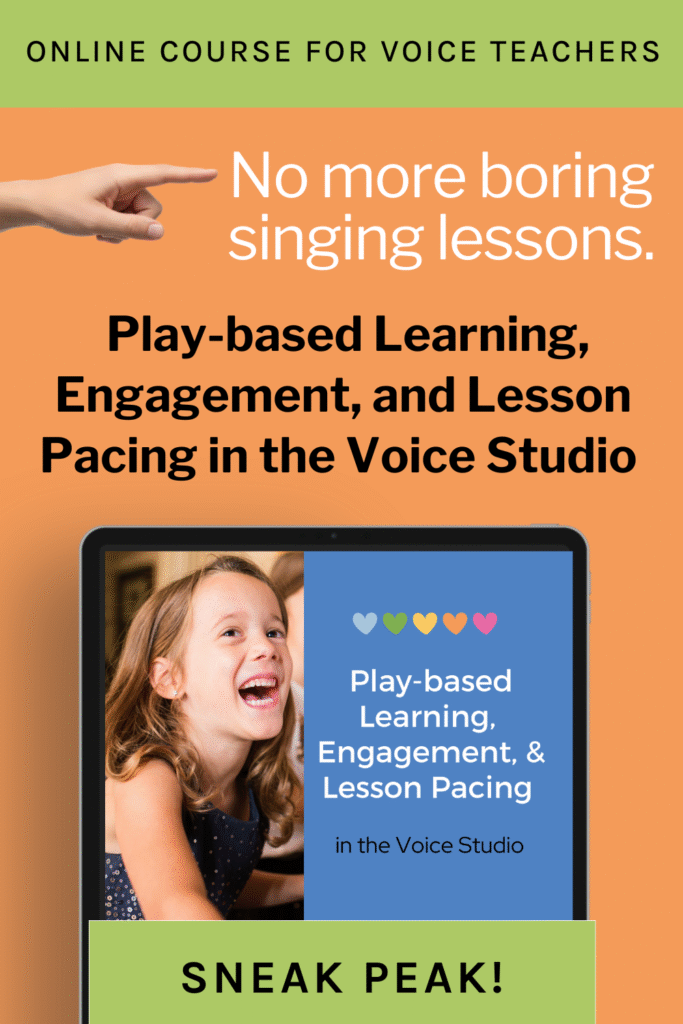 A young girl sitting at piano and smiling in an engaging singing lesson