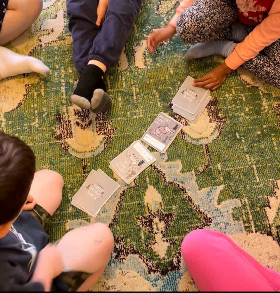 kids playing a game with the cards in Bethany's studio