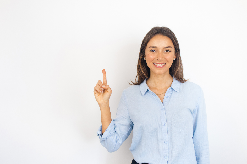 a teacher holding up their first finger